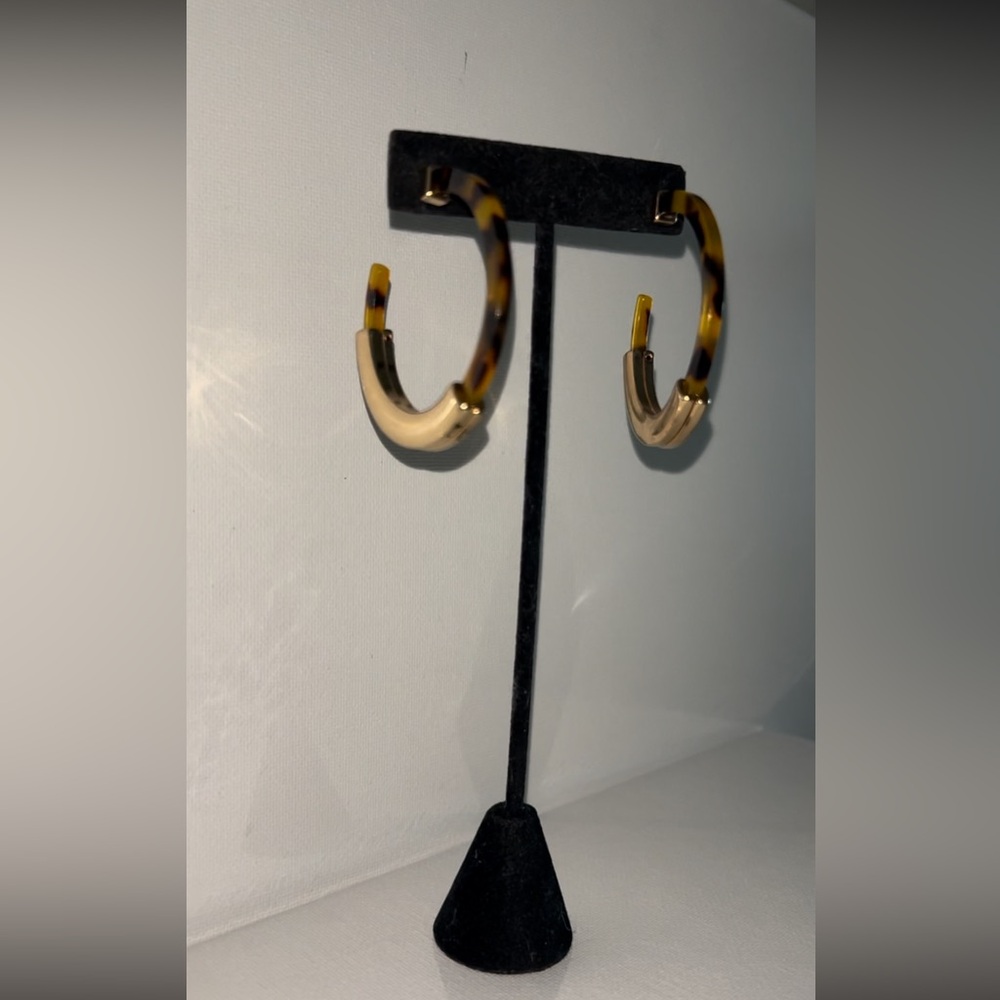 leopard printed hoops featuring a chic gold brass center